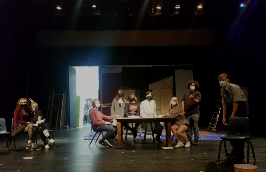 The cast rehearses a key scene.