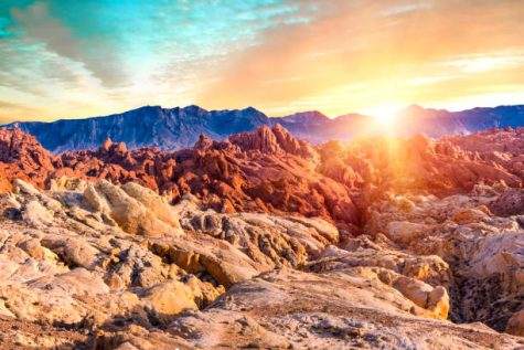 Amazing colors and shape of the sun setting over rocks in Fire Canyon, Valley of Fire State Park, Nevada, USA