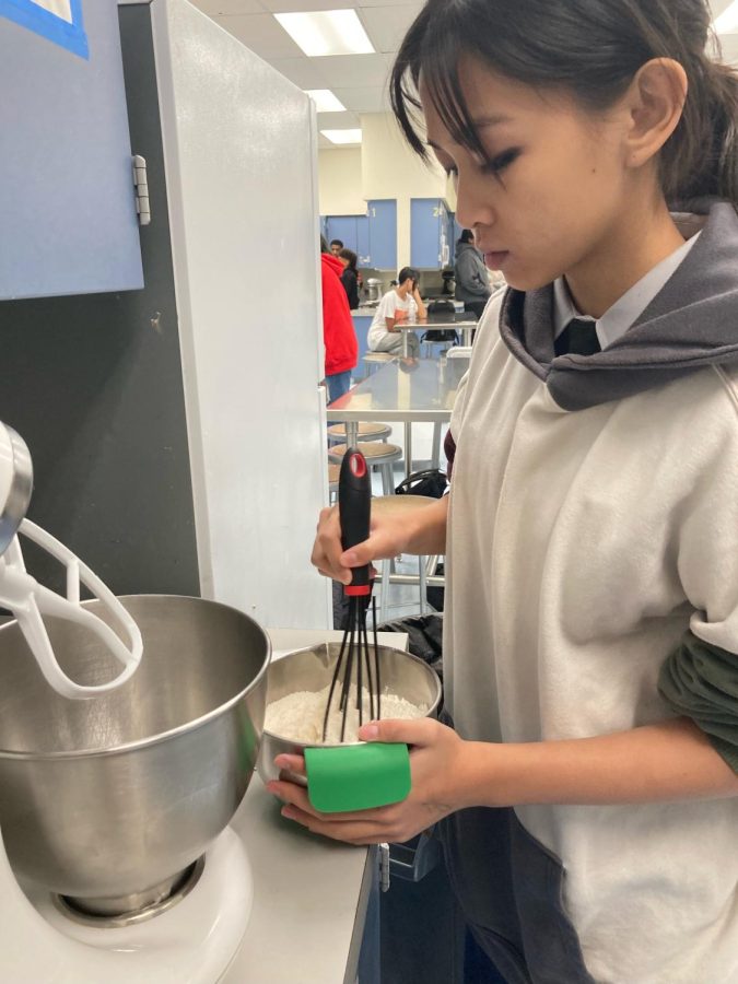 Culinary student, Kaia Santos, preparing cookie dough