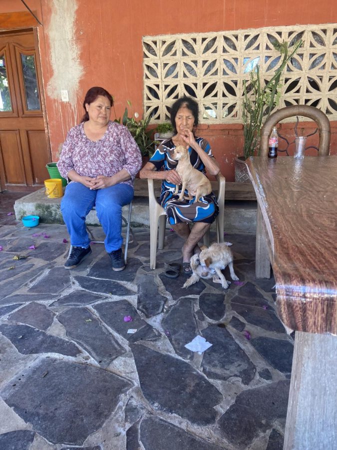 Dora Rodriguez and her mother, Maria Flores sit on her front porch in Jalisco Mexico during Dora’s long-awaited trip to visit her family.