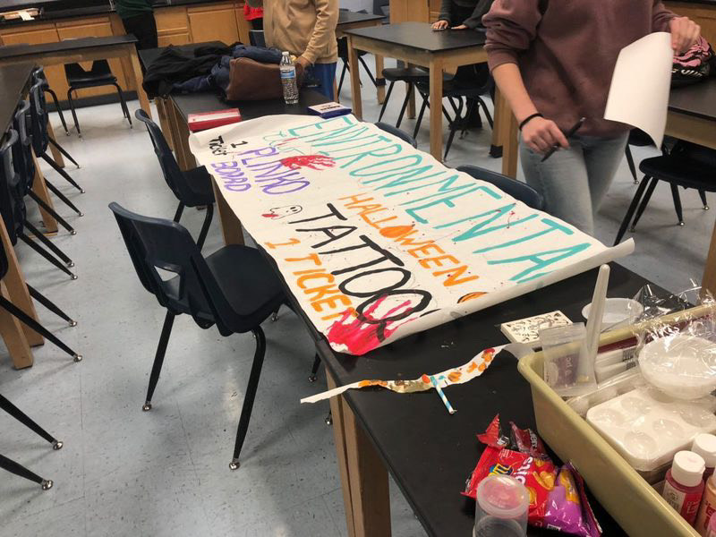 The Environmental Club preparing a poster for Student Councils Fright Night