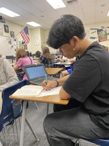 Ronan Jon Tumang, a freshman student attending Sierra Vista High School working in his honors English class.
