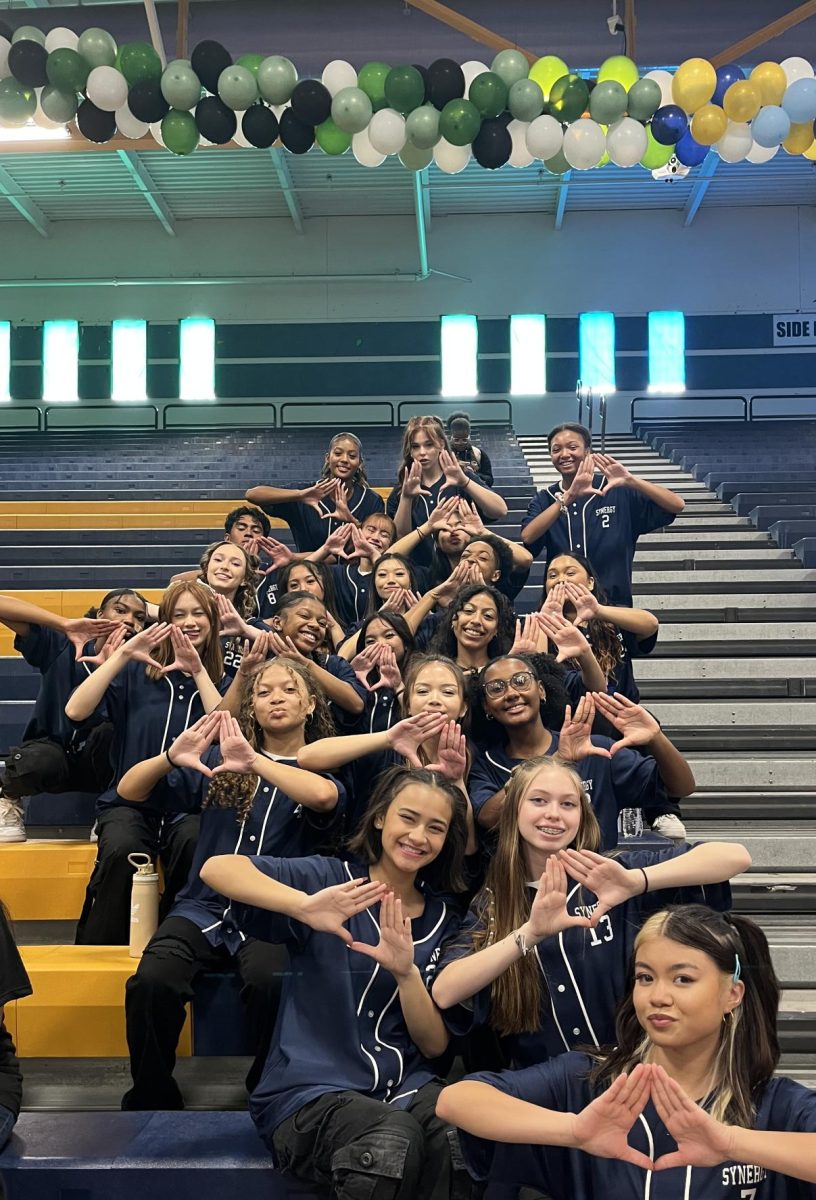 Sierra Vista High Schools dance and step team, Synergy, prepares for their performance at the Homecoming week assembly on October 13.