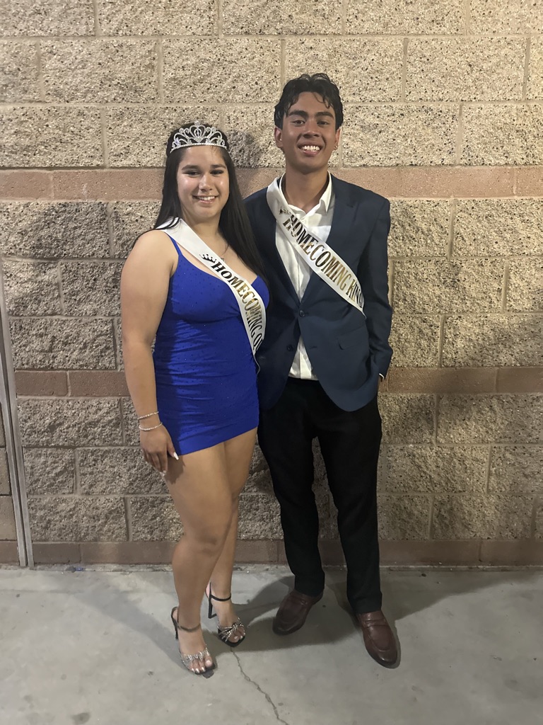 Seniors Melanie Radan and Ray Solis, crowned Homecoming Queen and King on October 14, 2023, pose to capture an unforgettable night woven with the enchantment of A Tale as Old as Time.
