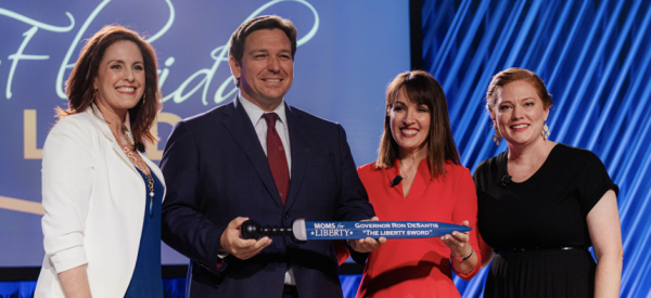 Florida Governor Ron DeSantis receives a ceremonial Liberty Sword at the 2022 Moms for Liberty National Summit in Tampa, Florida. (via Florida Governors Office)