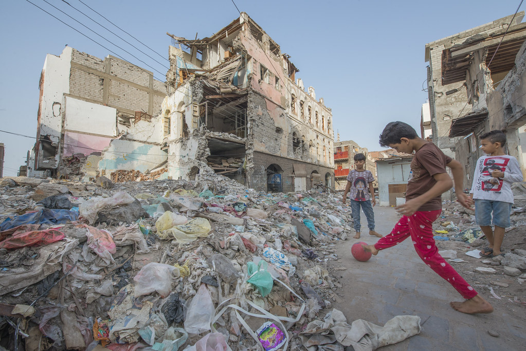 Ruined City. Yemeni children playing in the rubble of their demolished town. 