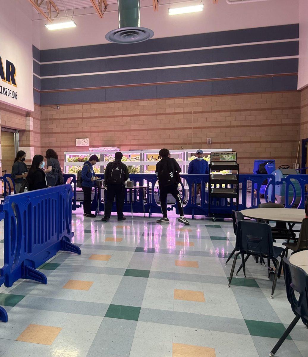 Students at first lunch on Tuesday, April 16th, 2024 grab food from the lunch line as well as the drop carts, also known as Sharing stations.