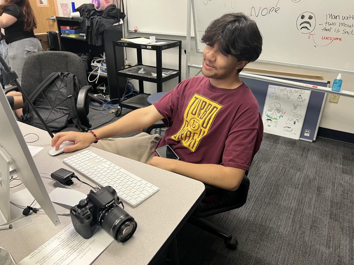 
Derek Iraheta (11) works diligently, looking through the footage of the anchors for any mistakes before uploading it into the video production Google drive.