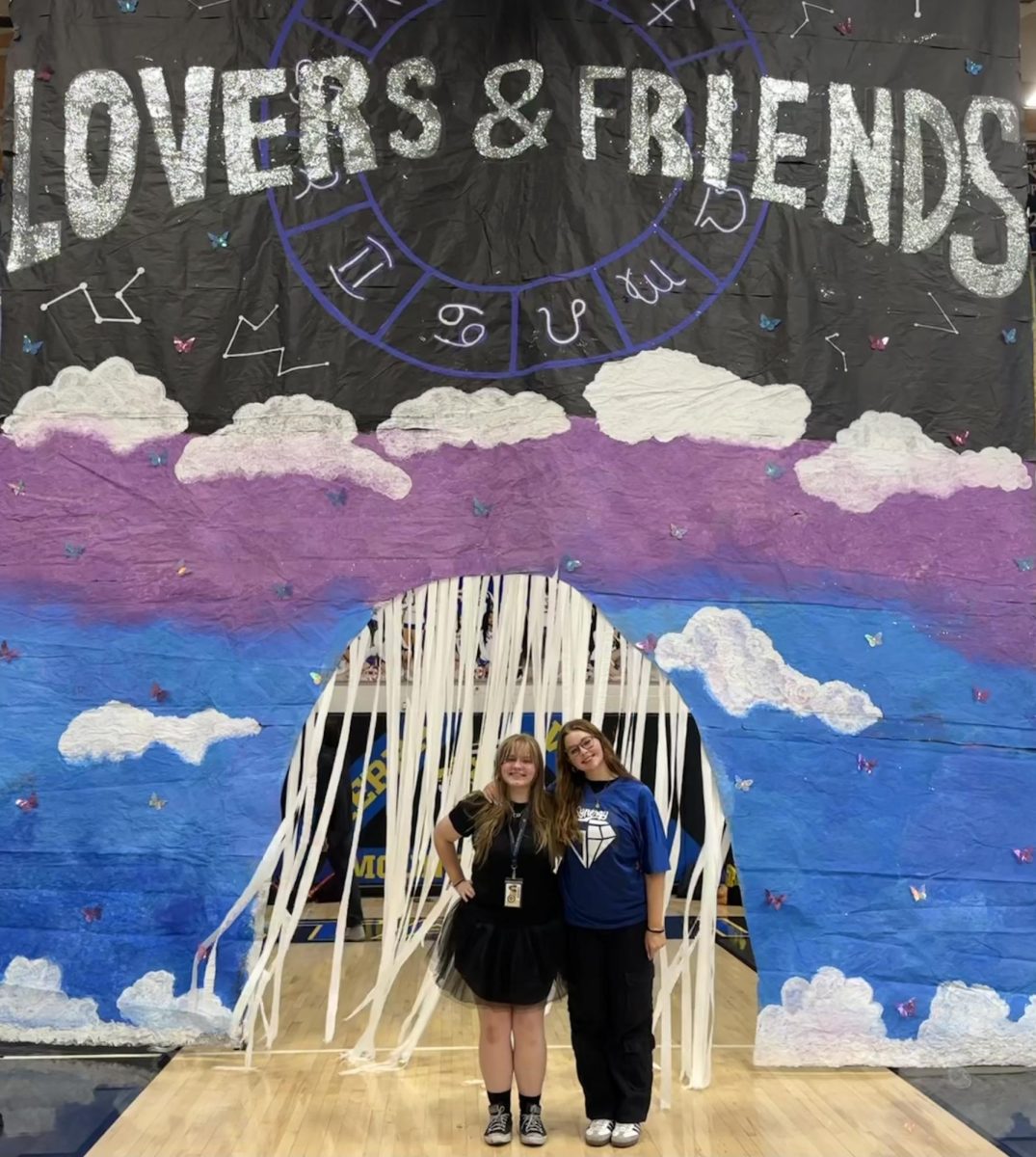 Student body first vice president, Hannah Reed (11), and student body second vice president, Mckenzie Gidge (11), celebrate together after their successful Homecoming assembly themed, Lovers and Friends.
Delete comment: -Eliana Booth (11) rocks her 90's themed outfit on September 26 during Sierra Vista's Homecoming spirit day, Throwback Thursday. -Madalyn Reiter (11) and Nora Baltera (10) pose in front of Student Councils spirit day windows in their 90's gear on Throwback Thursday. - Sierra Vista High School's volleyball players Arae'yaa Love Pearson (12) and Hayhay Manibusan (9) show their school spirit on Throwback Thursday before their game where they faced off and won against Liberty High School. - Student body first vice president, Hannah Reed (11), and student body second vice president, Mckenzie Gidge (11), celebrate together after their successful Homecoming assembly themed, Lovers and Friends.
