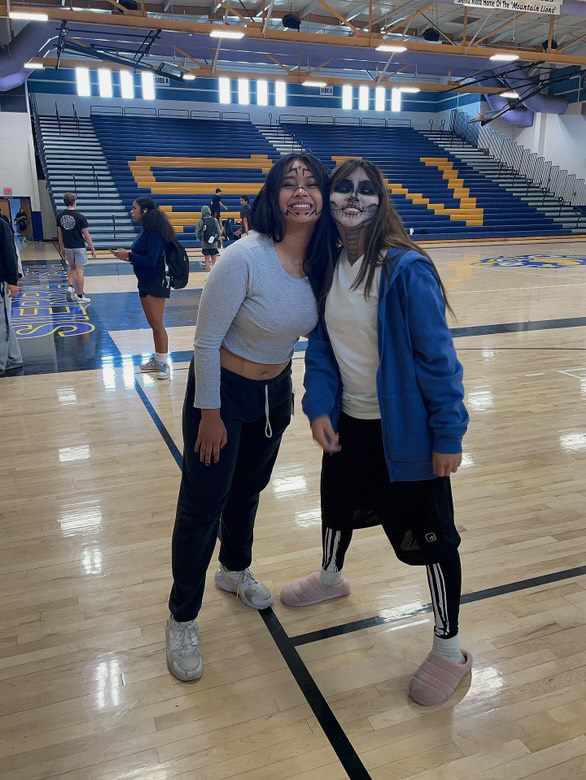 Calaya Saunders (11) and Arissa Garcia (11) bring the spirit of Halloween, with Arissa in a bone-chilling skeleton look while Calaya is showing off her festive spirit right before Halloween.