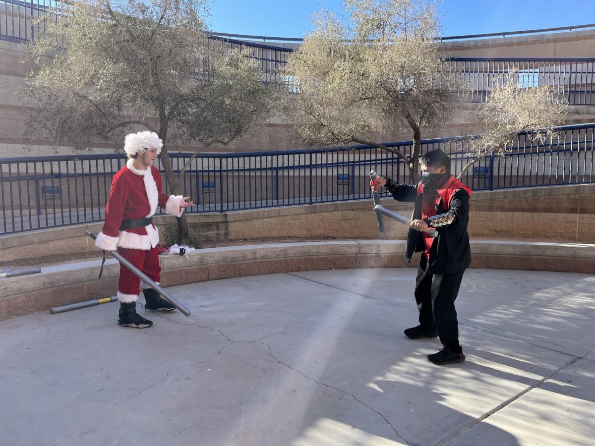 Dueling Club Historian Alex Vega (9), and Zavyn Biniek prepare to duel with each other.