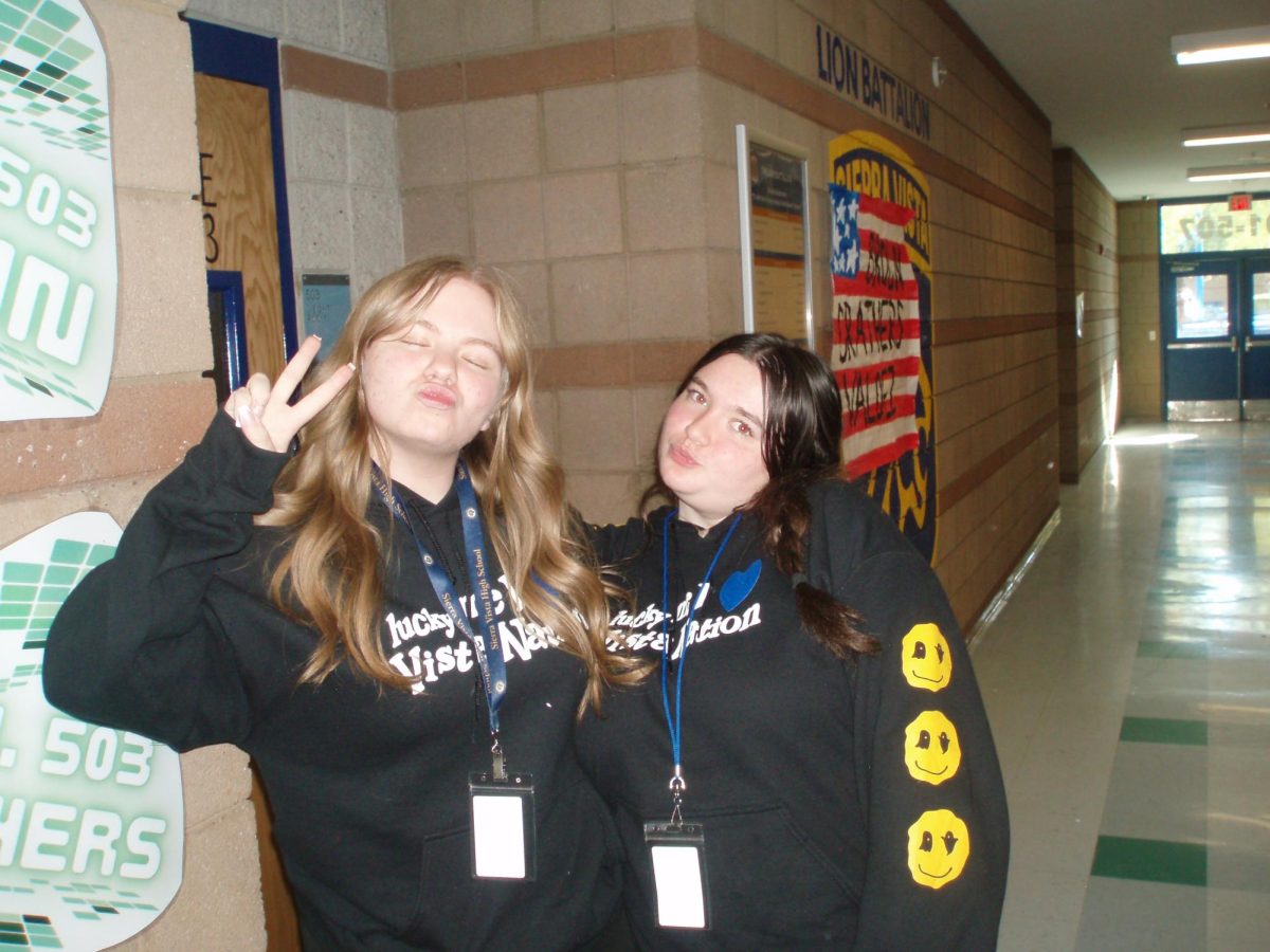 Hannah Reed (11) and Nora Baltera(10) match during Twin Day, a highlight of Winter Spirit Week, showcasing their coordinated outfits and school spirit.