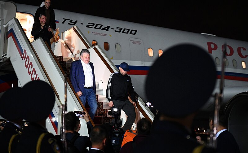 Vadim Krasikov, 58, arrives at Vnukovo International Airport in Moscow wearing a baseball cap, Krasikov tops Russia's priority list of desired prisoners. (image sourced from Wikipedia, photographer not named, attributed to www.kremlin.ru, licensed under Creative Commons Attribution 4.0.