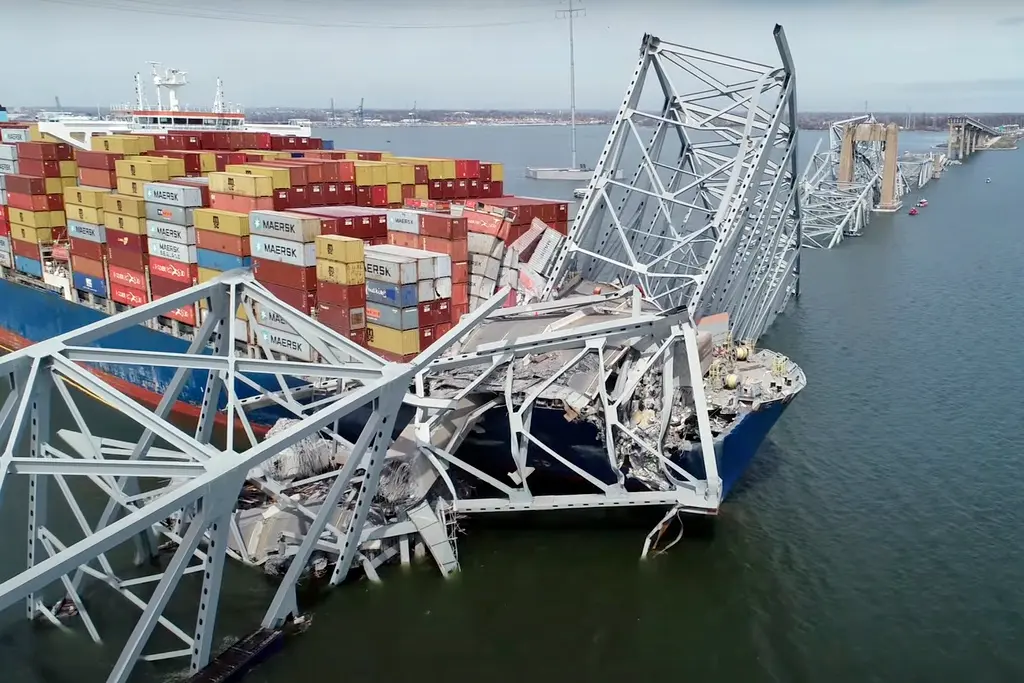 Taking a nosedive into the Patapsco River, the Francis Scott Key Bridge in Baltimore, Maryland plummets after a container ship, the Dali, collides with one of its pillars, finding itself stuck underneath the Key Bridge. (Uploaded for Creative Commons License by FMT)