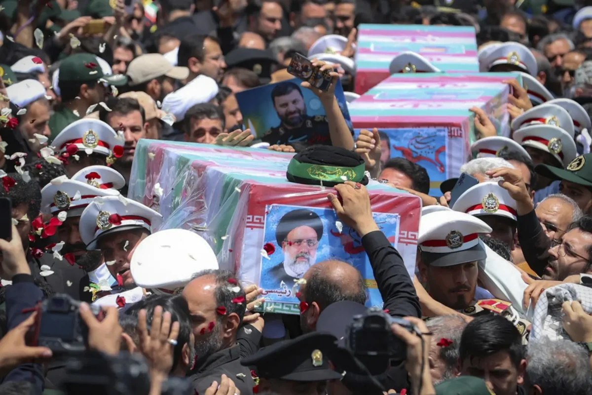 Statewide Mourning. Coffins of President Raisi alongside his comrades during their funeral ceremony in Mashhad, Iran. (Photo Credit: Iranian Presidency Office, uploaded by Free Malaysia Today for Creative Commons License)