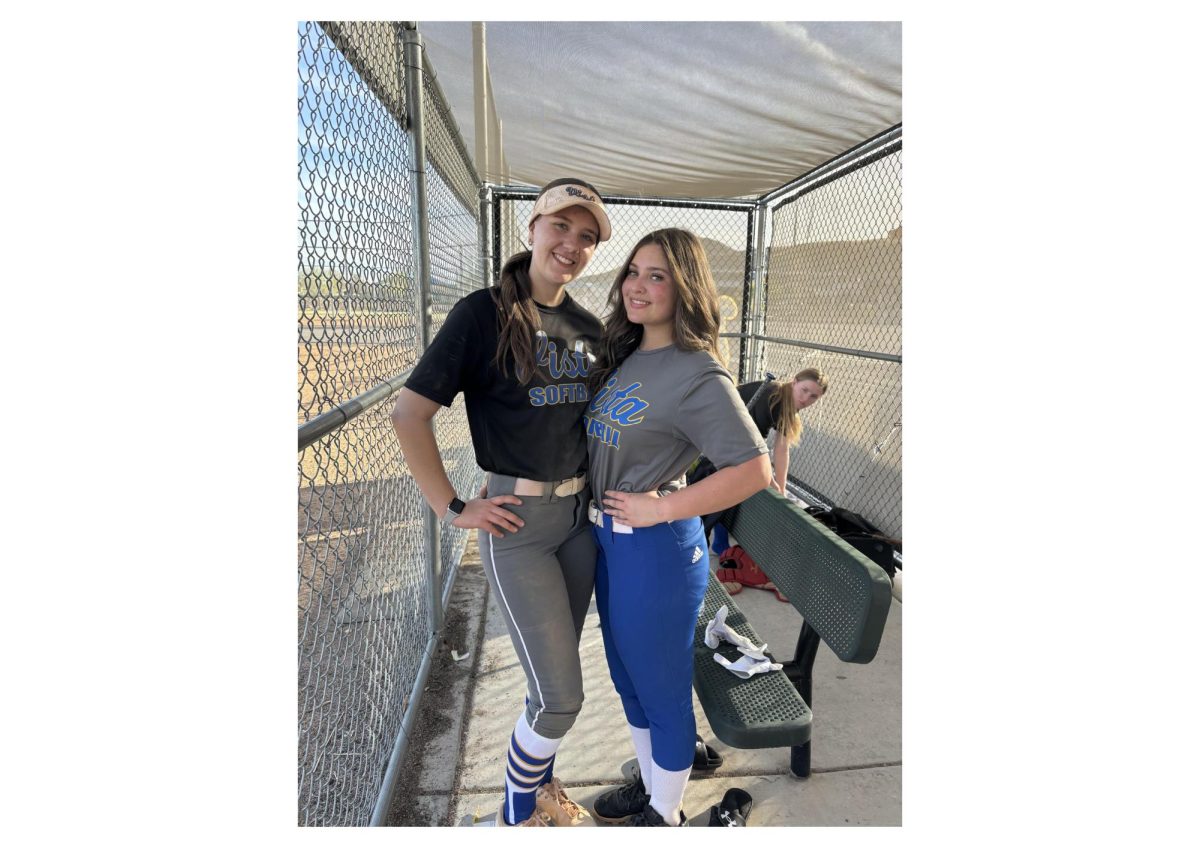 Reagan Foglia (12) and Makenzie Best (12) in the dugout at Faiss Middle School after their first practice.