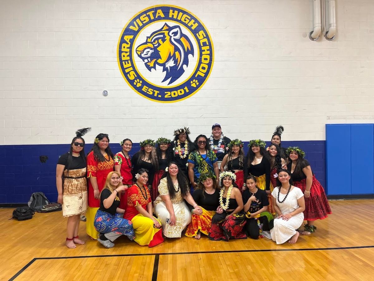 Preparing for their performance, Sierra Vista High School's Polynesian Club proudly wears their cultural pa'u and kīkepas, representing their pride for both their club and their culture.