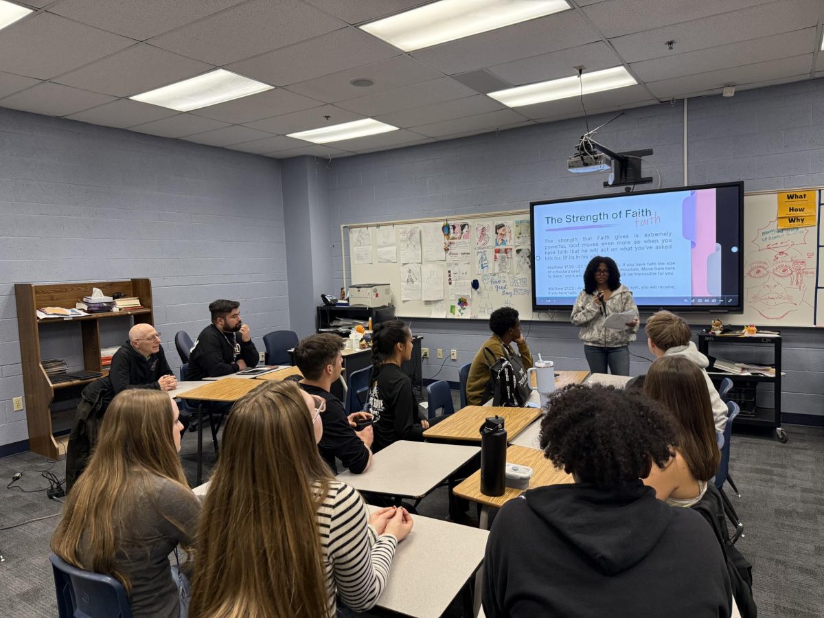 All ears to Layla Sweeney (12) as she leads Vista's Bible Club members in the discussion on what the Bible teaches about the power of faith.