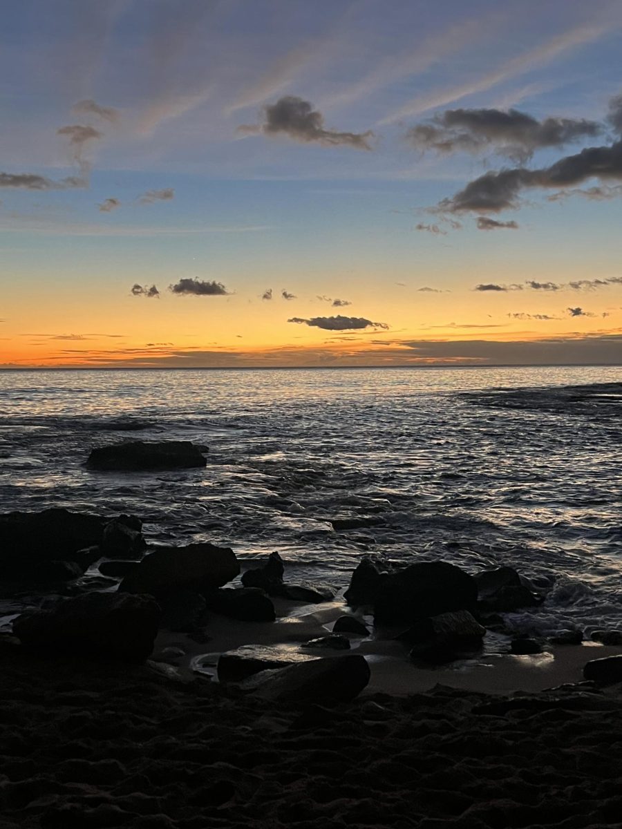 The sun sets over the beach in Honolulu, Hawaii a favorite destination for Vegas residents.