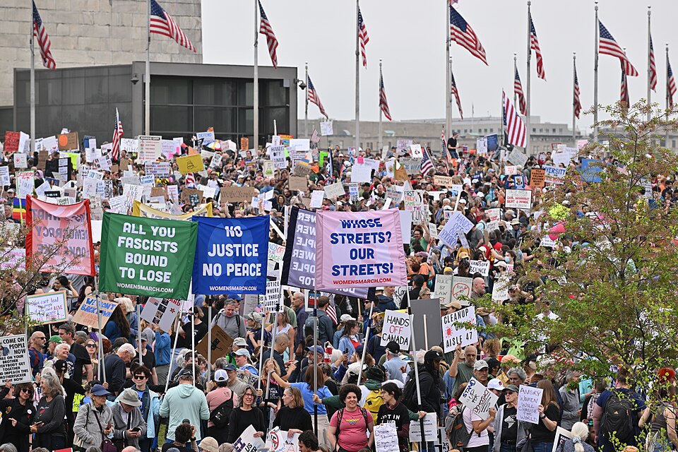 Hands-Off rally, Washington, DC
Protesters rally around D.C.'s Washington Monument for the Hands Off Movement on April 5, 2025. (Taken by G. Edward Johnson, uploaded on Wikipedia under CC by 4.0, https://commons.wikimedia.org/wiki/File:2025-04-05_Hands-Off_Rally_Washington_DC_13-18-50_1.jpg)