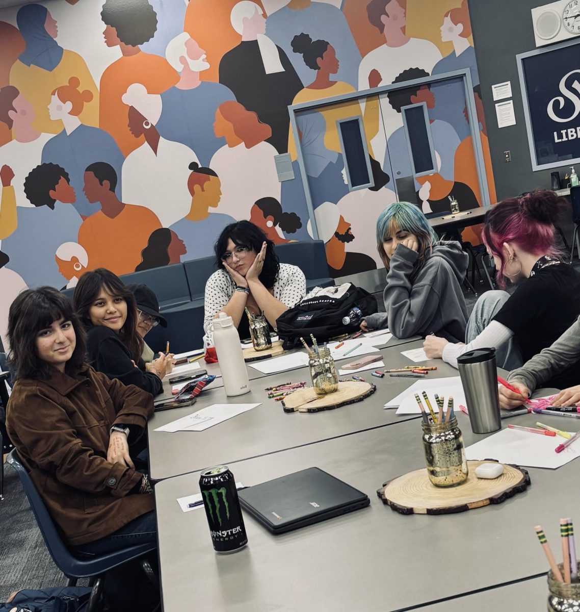 The Art Club taking a short break after working hard making uplifting cards for our teachers.