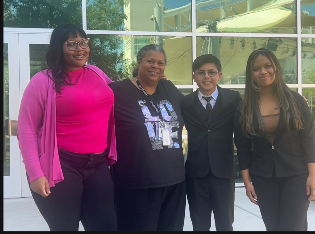 Lia Murrell (12), Ms Freeman, Deangelo Galicianao (9), and Abigail Gamboa (9) at their first competition at Northwest Career and Technical Academy in September.
