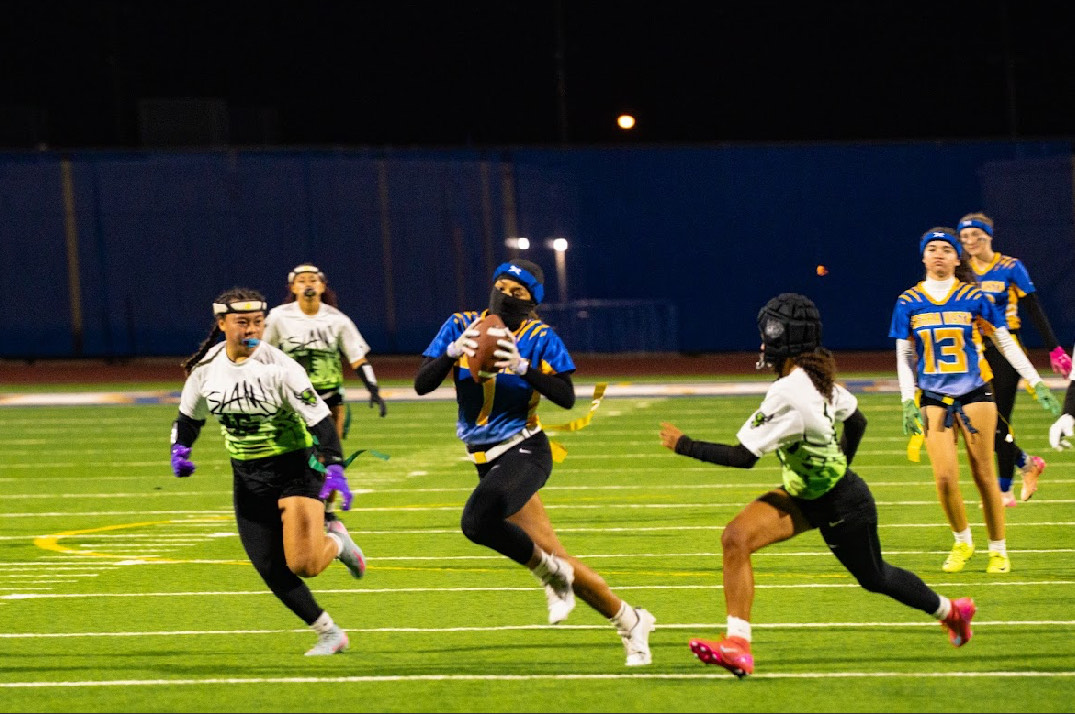 On the night of December 9th, Lydia Masnica (12) controls the traffic of defenders on the field, carrying the ball-- and her pride-- down the turf against the SLAM! Bulls.