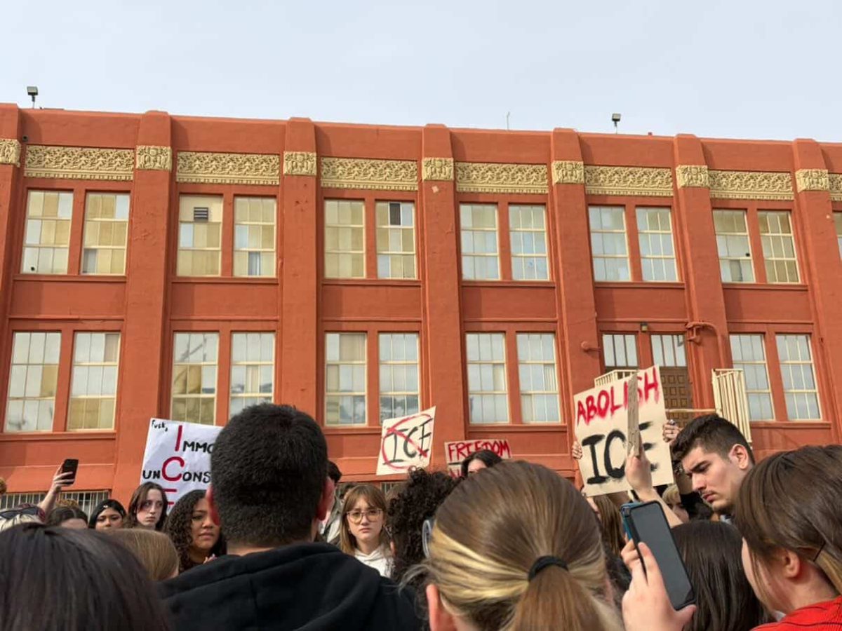 Students from The Las Vegas Academy of the Arts gather to protest ICE on January 21st. - LVA students raise their signs in order to spread their message of hope and justice. All photo credits to Haven Anderson