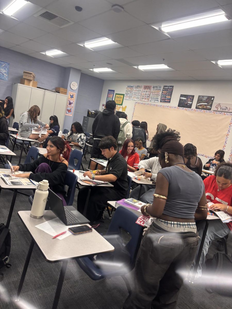 Fashion Club members get creative with magazines and crafting supplies to make their own new and unique outfits.