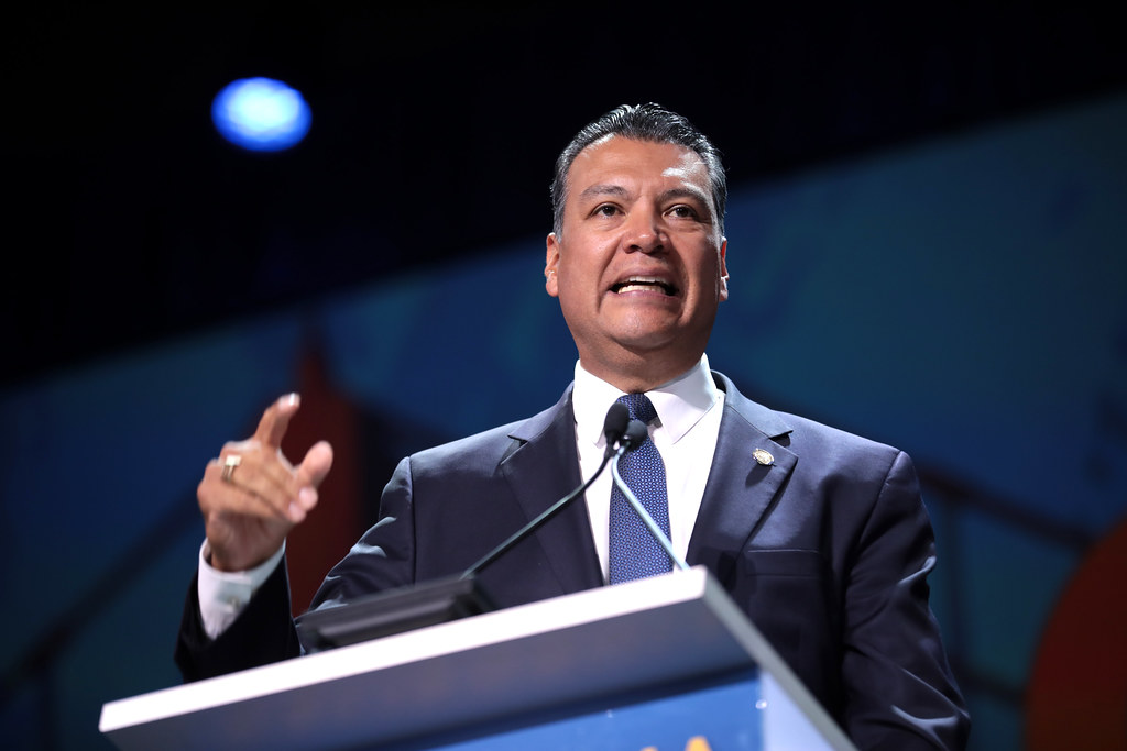 Senator Alex Padilla addresses crucial information during a press conference. Drawing attention with a gesture. (Attributions Gage Skidmore) https://www.flickr.com/photos/gageskidmore/48002914183